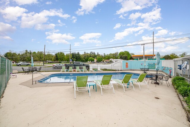 5616 W Houghton Lk, Houghton Lake, MI 48629 - community pool with a patio area