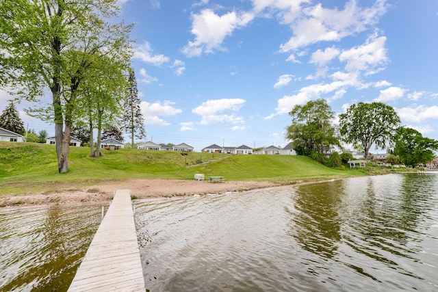 5616 W Houghton Lk, Houghton Lake, MI 48629 - dock area with a water view, a residential view, and a lawn