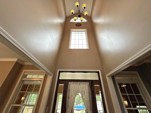 N1746 Smith Rd, Saint Ignace, MI 49781 - entryway with a towering ceiling, a chandelier, and plenty of natural light