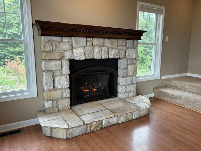 N1746 Smith Rd, Saint Ignace, MI 49781 - detailed view of a stone fireplace and wood finished floors