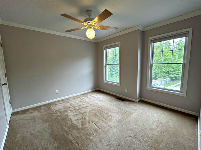 N1746 Smith Rd, Saint Ignace, MI 49781 - carpeted spare room featuring crown molding and ceiling fan