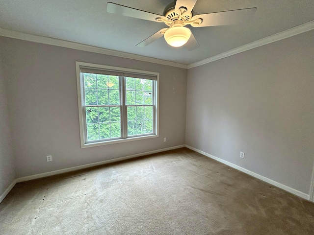 N1746 Smith Rd, Saint Ignace, MI 49781 - spare room with carpet floors, crown molding, and a ceiling fan