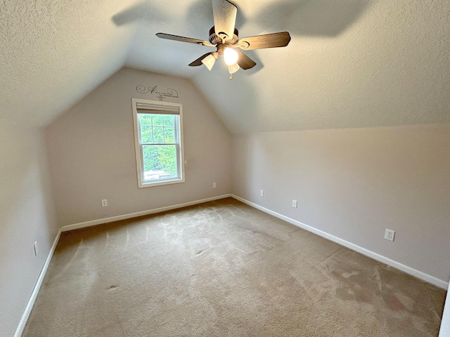 N1746 Smith Rd, Saint Ignace, MI 49781 - bonus room with a textured ceiling, carpet, a ceiling fan, and lofted ceiling