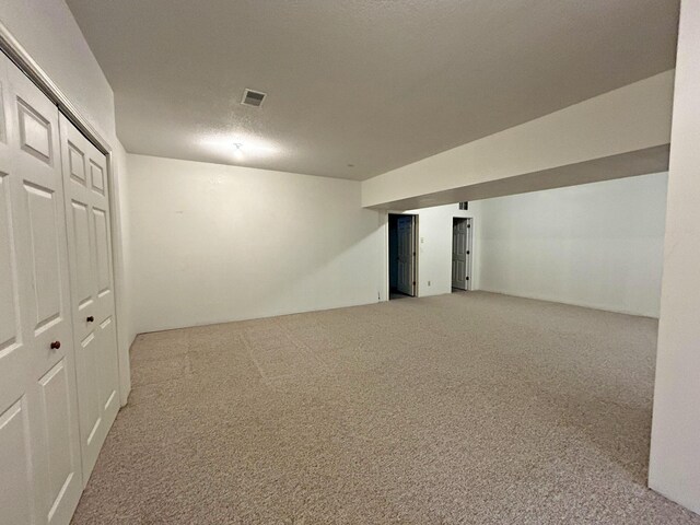 N1746 Smith Rd, Saint Ignace, MI 49781 - finished below grade area featuring carpet floors