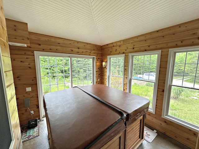 N1746 Smith Rd, Saint Ignace, MI 49781 - dining area featuring wood walls and plenty of natural light