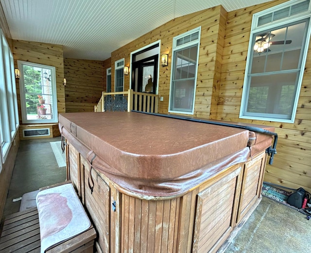 N1746 Smith Rd, Saint Ignace, MI 49781 - game room featuring wood walls and ceiling fan