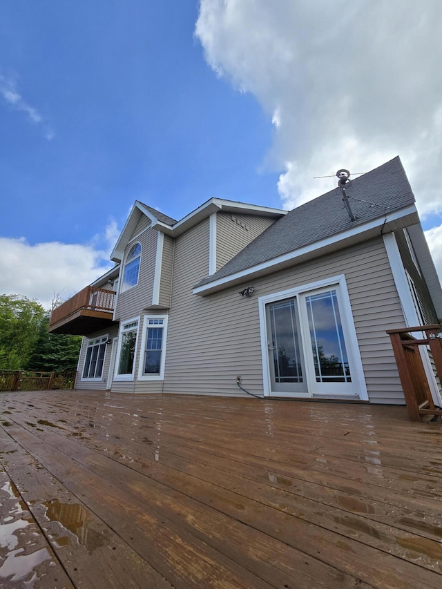 N1746 Smith Rd, Saint Ignace, MI 49781 - rear view of property featuring a deck and a shingled roof