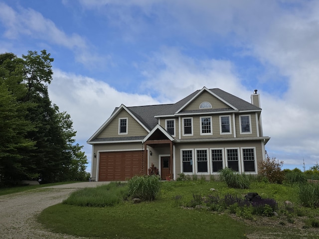 N1746 Smith Rd, Saint Ignace, MI 49781 - view of front of home with gravel driveway and a chimney