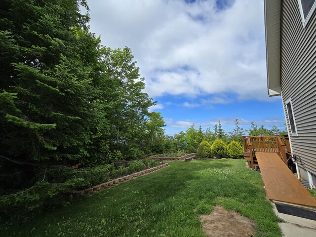 N1746 Smith Rd, Saint Ignace, MI 49781 - view of grassy yard featuring a wooden deck