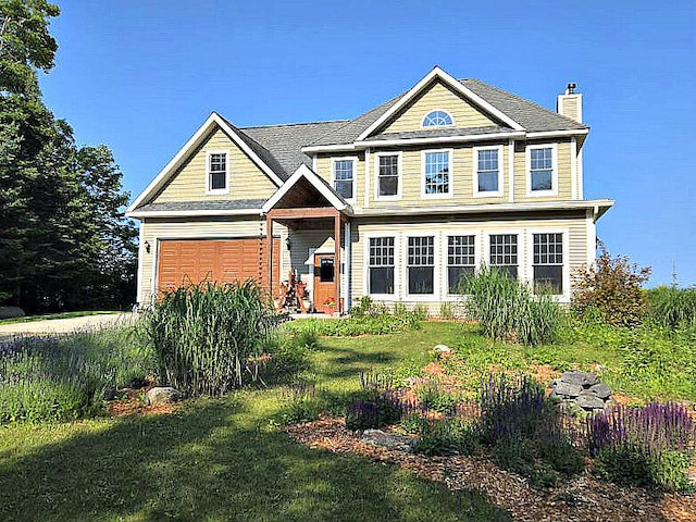 N1746 Smith Rd, Saint Ignace, MI 49781 - craftsman inspired home featuring a chimney and a front yard