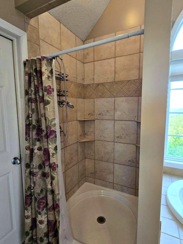 N1746 Smith Rd, Saint Ignace, MI 49781 - bathroom with a tile shower and vaulted ceiling