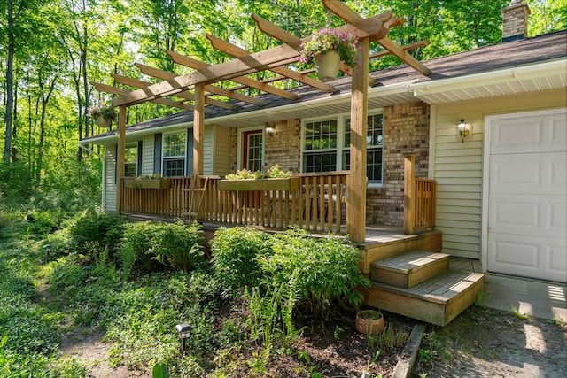 9707 Rogers Rd, Alanson, MI 49706 - doorway to property featuring a pergola and a chimney