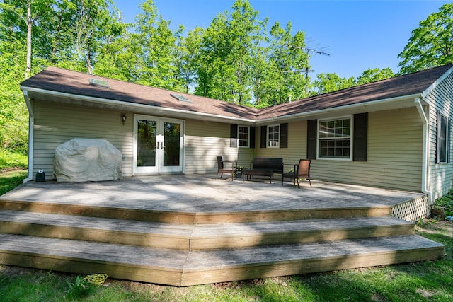 9707 Rogers Rd, Alanson, MI 49706 - rear view of house featuring french doors and a wooden deck
