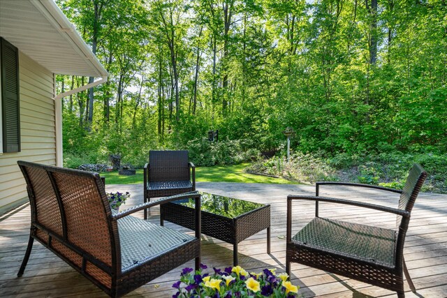9707 Rogers Rd, Alanson, MI 49706 - wooden terrace featuring an outdoor living space
