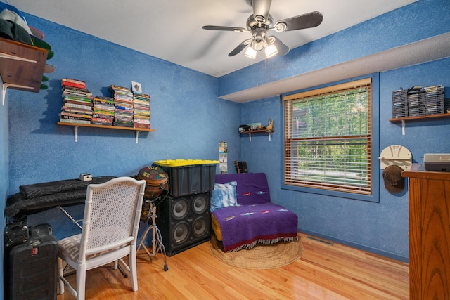 9707 Rogers Rd, Alanson, MI 49706 - office featuring wood finished floors, ceiling fan, a textured wall, and baseboards