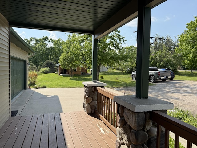 1058 Marlas Way, Cheboygan, MI 49721 - wooden terrace featuring a lawn and view of wooded area
