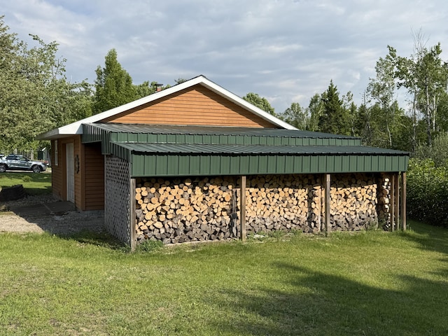 1058 Marlas Way, Cheboygan, MI 49721 - view of side of property featuring a yard and metal roof