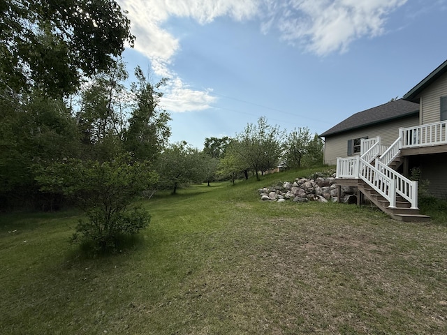 1058 Marlas Way, Cheboygan, MI 49721 - view of grassy yard with stairway and a deck