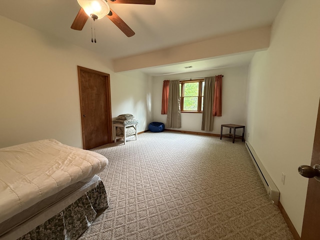 1058 Marlas Way, Cheboygan, MI 49721 - carpeted bedroom featuring a baseboard heating unit, baseboards, and a ceiling fan