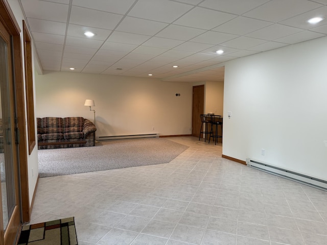 1058 Marlas Way, Cheboygan, MI 49721 - empty room with recessed lighting, baseboard heating, a drop ceiling, and light tile patterned floors