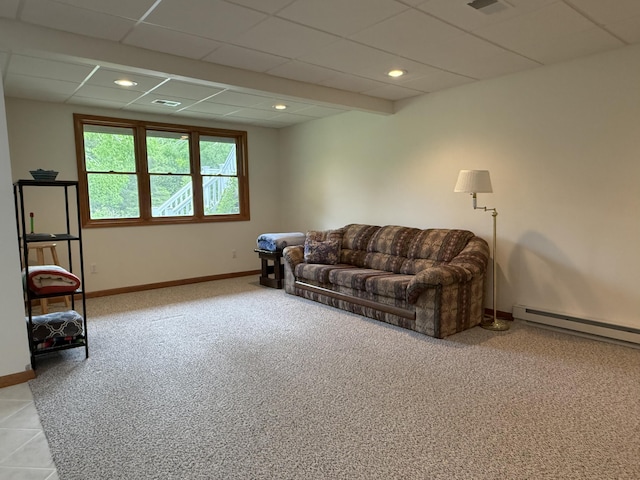 1058 Marlas Way, Cheboygan, MI 49721 - living area featuring light colored carpet, baseboards, a baseboard heating unit, and a paneled ceiling