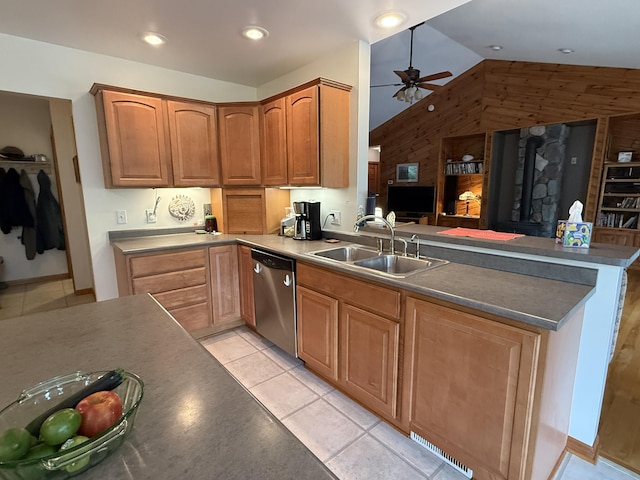 1058 Marlas Way, Cheboygan, MI 49721 - kitchen featuring stainless steel dishwasher, a sink, vaulted ceiling, ceiling fan, and a peninsula