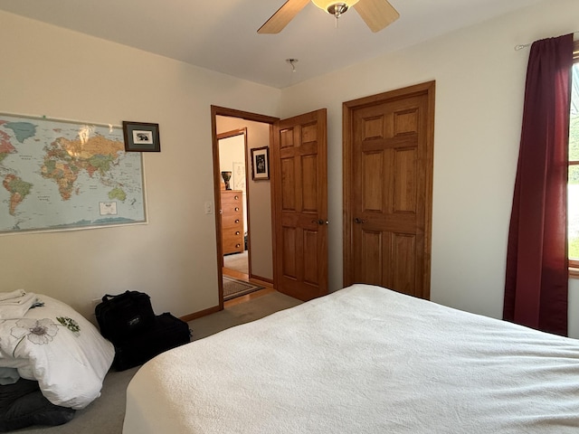 1058 Marlas Way, Cheboygan, MI 49721 - bedroom featuring ceiling fan, carpet, and baseboards
