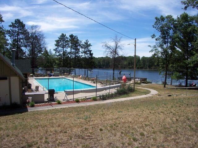 5265 Woodridge Dr, Lewiston, MI 49756 - community pool with a water view