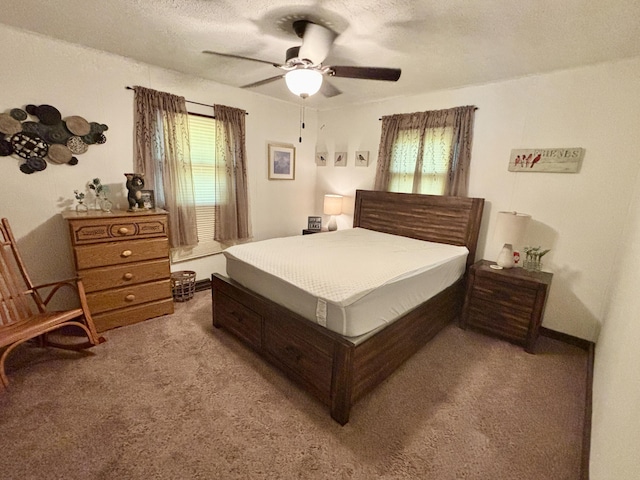 5265 Woodridge Dr, Lewiston, MI 49756 - bedroom featuring carpet flooring, multiple windows, a textured ceiling, and ceiling fan