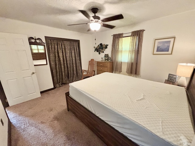 5265 Woodridge Dr, Lewiston, MI 49756 - bedroom featuring carpet, ceiling fan, and a textured ceiling