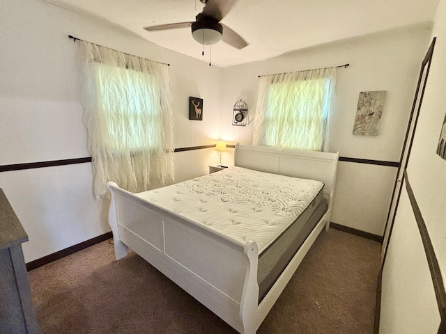 5265 Woodridge Dr, Lewiston, MI 49756 - bedroom featuring multiple windows, carpet, and baseboards