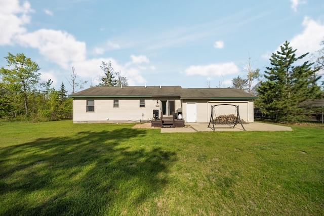 5918 Neumann Rd, Lewiston, MI 49756 - rear view of property with a patio area and a lawn