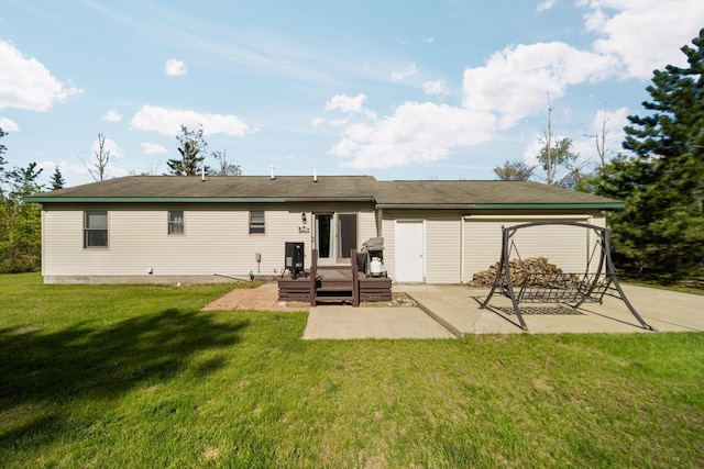5918 Neumann Rd, Lewiston, MI 49756 - back of house with a patio area, a yard, and a deck