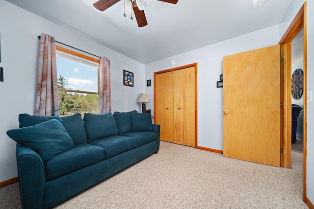 5918 Neumann Rd, Lewiston, MI 49756 - carpeted living room featuring ceiling fan and baseboards