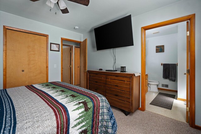 5918 Neumann Rd, Lewiston, MI 49756 - bedroom with carpet floors, ensuite bathroom, a closet, and a ceiling fan