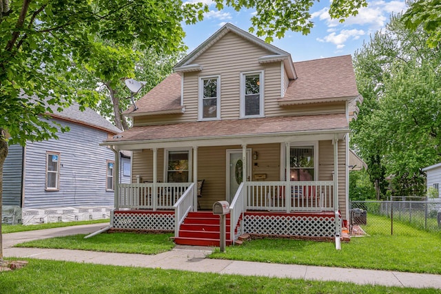 211 S Birney St, Bay City, MI 48708 - bungalow featuring a shingled roof and covered porch
