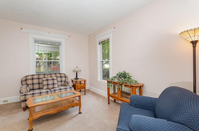 211 S Birney St, Bay City, MI 48708 - living area with light colored carpet, plenty of natural light, and baseboards