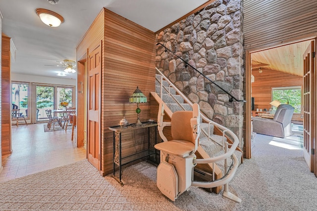 117 Timber Trl, Roscommon, MI 48653 - stairs with wooden walls, plenty of natural light, ceiling fan, and lofted ceiling