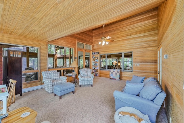 117 Timber Trl, Roscommon, MI 48653 - carpeted living room featuring wooden walls, wood ceiling, and ceiling fan