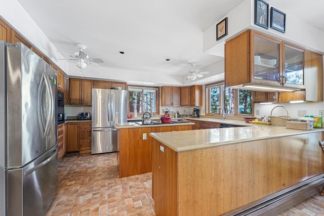 117 Timber Trl, Roscommon, MI 48653 - kitchen featuring black appliances, a ceiling fan, a peninsula, and brick patterned flooring