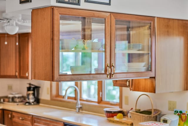 117 Timber Trl, Roscommon, MI 48653 - kitchen featuring brown cabinetry and light countertops