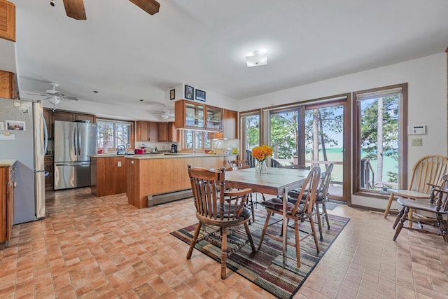 117 Timber Trl, Roscommon, MI 48653 - dining room featuring a ceiling fan and a baseboard heating unit