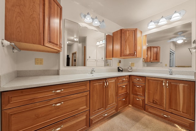 117 Timber Trl, Roscommon, MI 48653 - bathroom featuring double vanity and ceiling fan