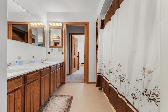 117 Timber Trl, Roscommon, MI 48653 - bathroom with double vanity and baseboards
