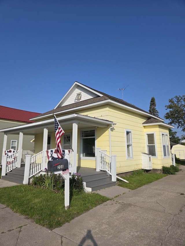 208 S S D St, Cheboygan, MI 49721 - view of front of property featuring covered porch