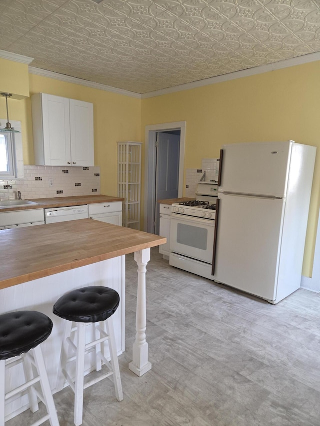 208 S S D St, Cheboygan, MI 49721 - kitchen with white appliances, butcher block counters, ornamental molding, an ornate ceiling, and white cabinets