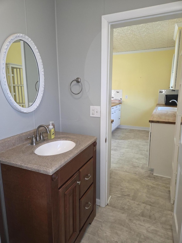 208 S S D St, Cheboygan, MI 49721 - bathroom with vanity and baseboards