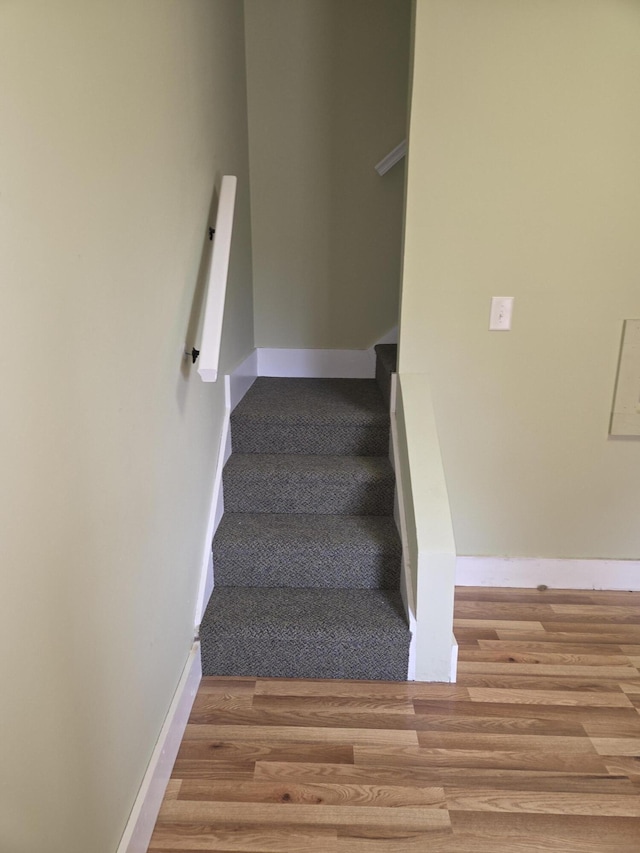 208 S S D St, Cheboygan, MI 49721 - stairway with wood finished floors and baseboards