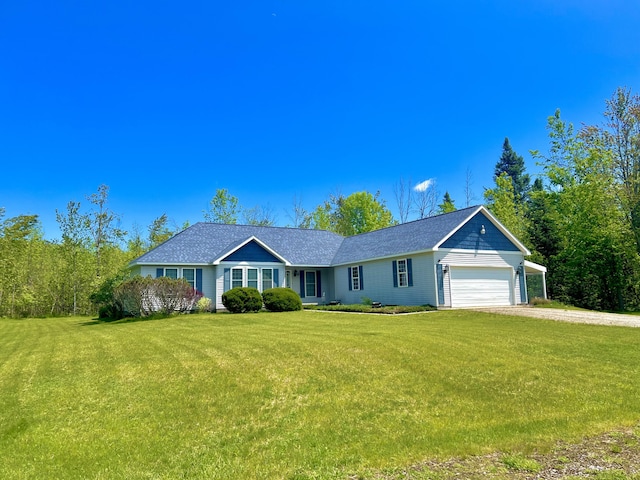 1745 Mullett Lake Woods Rd, Cheboygan, MI 49721 - single story home with an attached garage, driveway, and a front yard