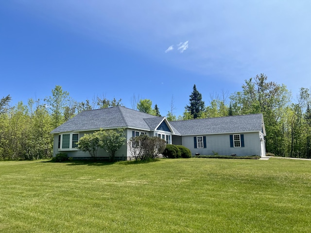 1745 Mullett Lake Woods Rd, Cheboygan, MI 49721 - ranch-style house with a front lawn